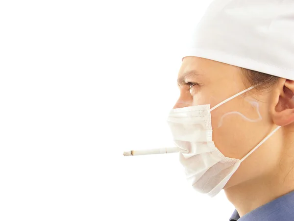 Young doctor with a cigarette — Stock Photo, Image