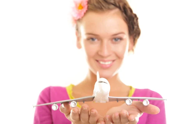 Young woman holding a plane — Stock Photo, Image