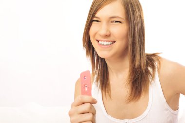 Young girl and pregnancy test clipart