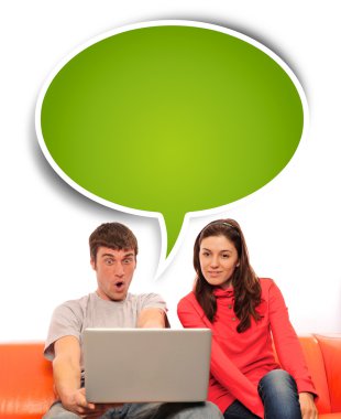 Portrait of a young couple using a computer. clipart