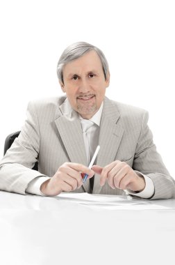 Portrait of an older businessman listening. clipart