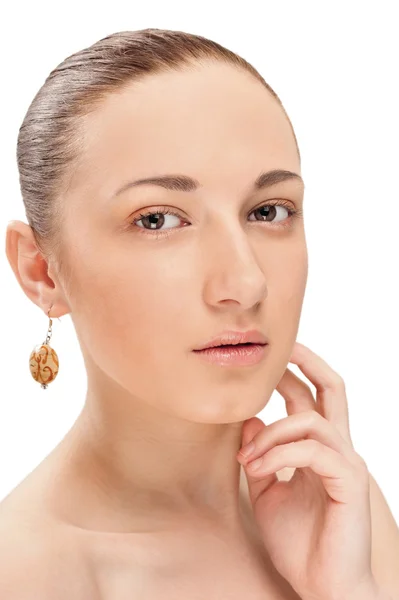 Portrait of a beautiful woman up-close and wearing an earing — Stock Photo, Image
