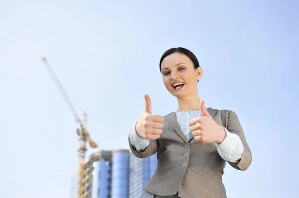 Portrait of a beautiful young businesswoman celebrating. — Stock Photo, Image