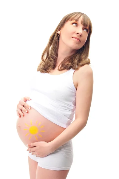 Зображення вагітної жінки, яка торкається її живота руками — стокове фото