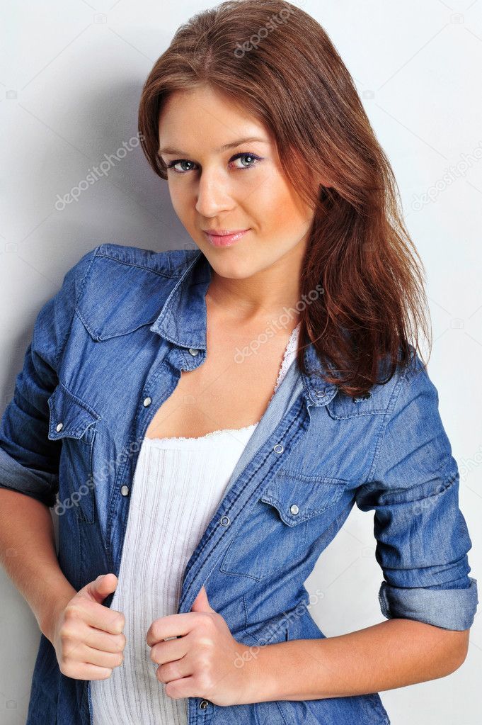 Portrait of a beautiful young woman wearing a denim shirt, tuggi