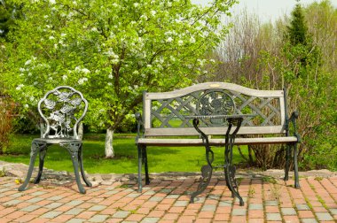 Patio furniture in the garden clipart