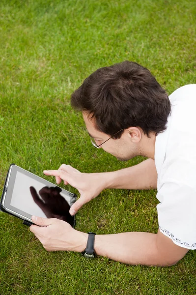 Man lying in the park at his backyard — Stock Photo, Image