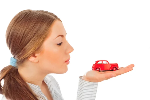 Closeup portrait of young pretty woman holding retro car in her — Stock Photo, Image