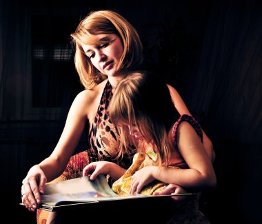 Closeup portrait of adult mother and her little daughter clipart
