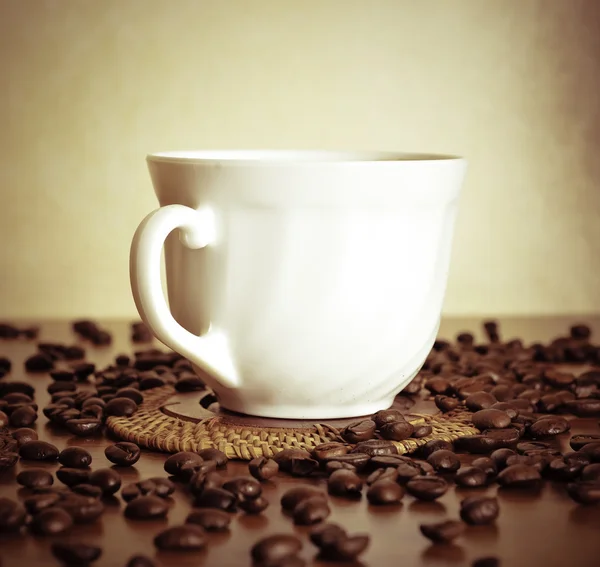 Warm cup of coffee on brown background — Stock Photo, Image