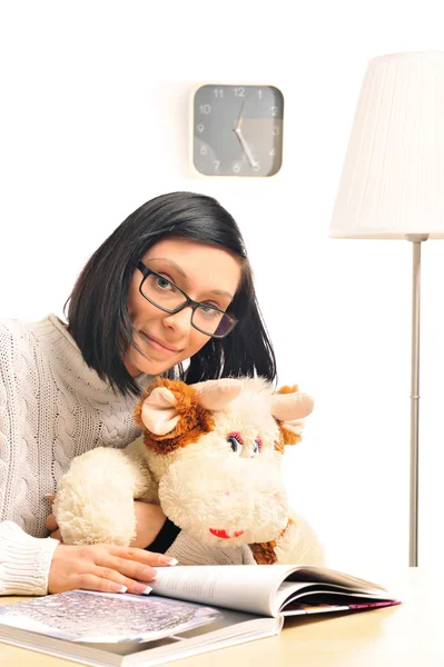 Closeup portrait of a young woman embracing her soft toy — Stock Photo, Image