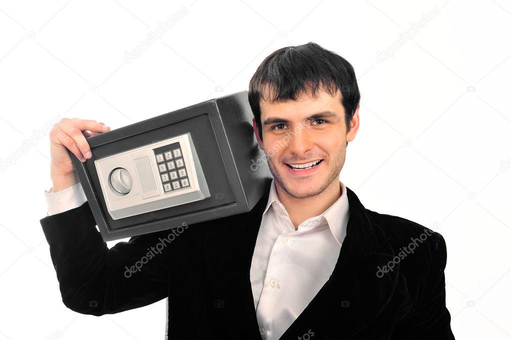 Portrait of young businessman holding metal safe