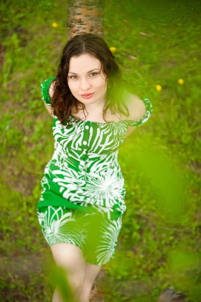 Closeup portrait of young beautiful woman wearing green dress si — Stock Photo, Image