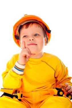 Little boy with helmet and tools. isolated on white. He is think clipart