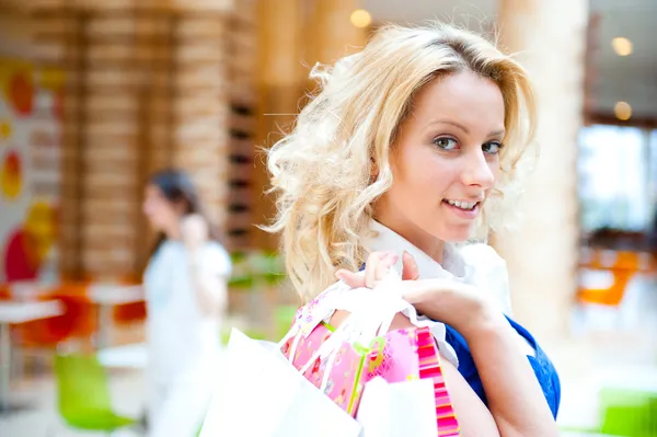 stock image Happy shopping woman with bags