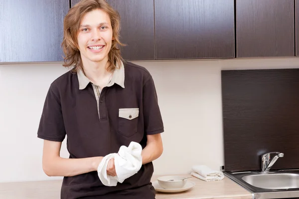 Happy young man after having a breakfast at home — Stock Photo, Image