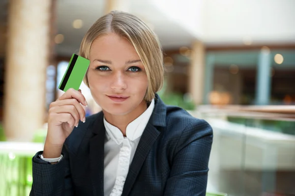 Closeup portrait of cute young business woman smiling while hold — Stock Photo, Image