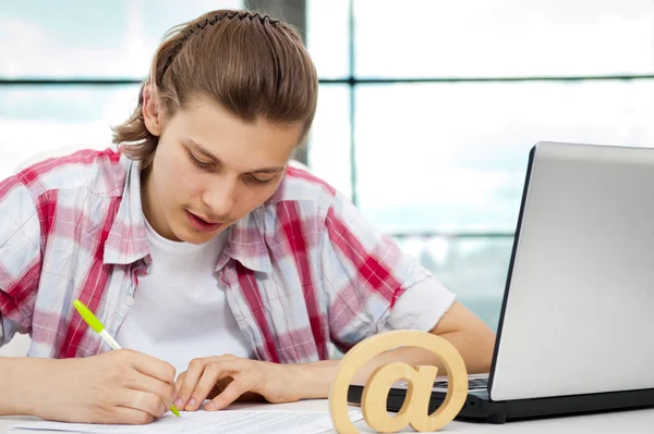 Portrait of handsome young man working with laptop on freelance — Stock Photo, Image
