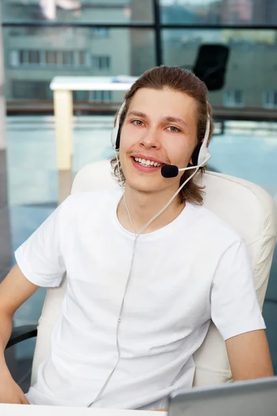 Close up of smiling customer service executive or student with he — стоковое фото