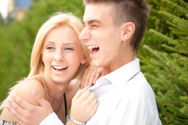 Young couple playing around in the nature - side view. Lots of c — Stock Photo, Image