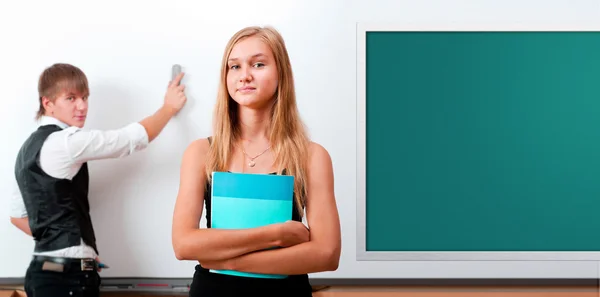 Two students - girl and boy making presentation at classroom — Stock Photo, Image