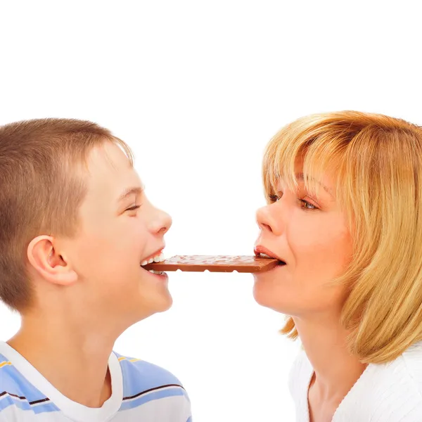 Portrait of happy european family of son and his mother eating c — Stock Photo, Image