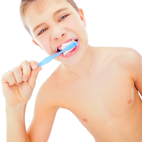 Beautiful boy brushing teeth, isolated on white — Stock Photo, Image
