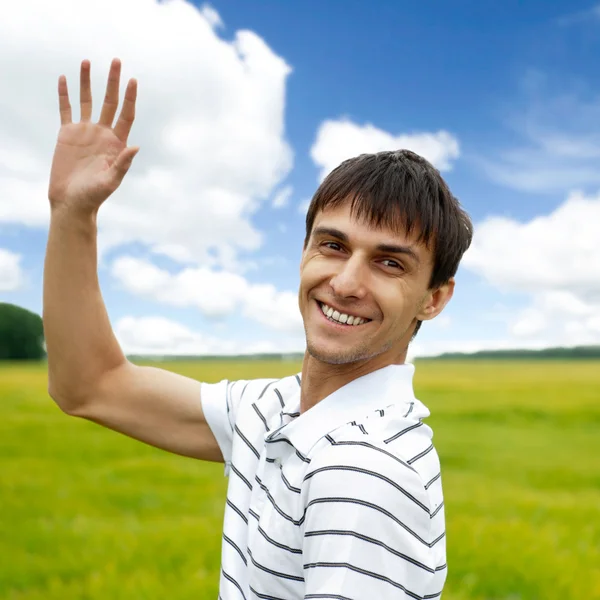 Portrait of young man taking energy from nature on vacation at c — Stock Photo, Image