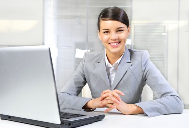 Beautiful business woman thinking about somethinking while worki clipart