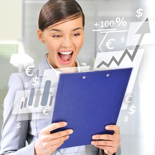 Portrait if young business woman at her office holding report — Stock Photo, Image