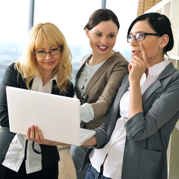 Closeup portrait of three women working indoor together with doc — Stock Photo, Image