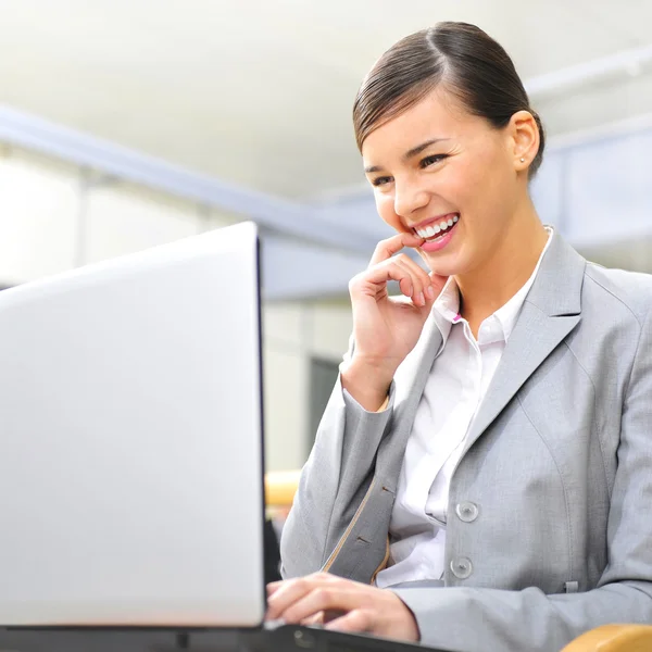 Beautiful business woman dreaming while working on computer at h — Stock Photo, Image