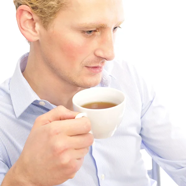 Un homme d'affaires prospère boit une tasse de café à son abricot — Photo