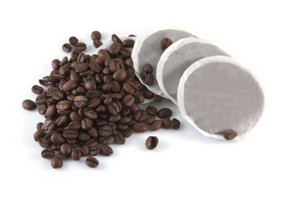 stock image Coffee beans and pads