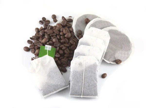 stock image Coffee beans, pads and tea bags