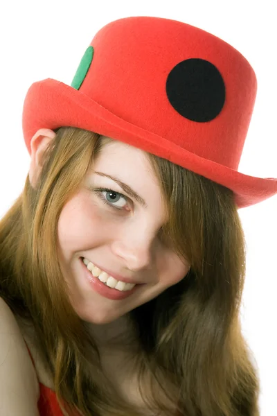 Portrait of the cheerful young girl in a red hat — Stock Photo, Image