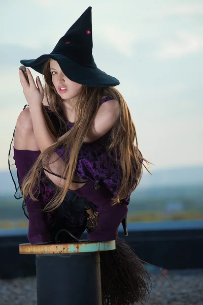 stock image Pretty witch with hat and broom