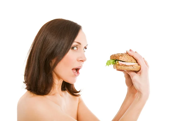 ผู้หญิงกินเบอร์เกอร์ — ภาพถ่ายสต็อก