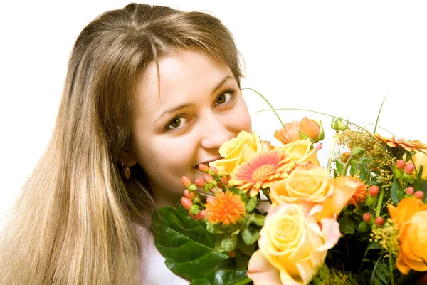 Young blond woman with flowers Royalty Free Stock Photos