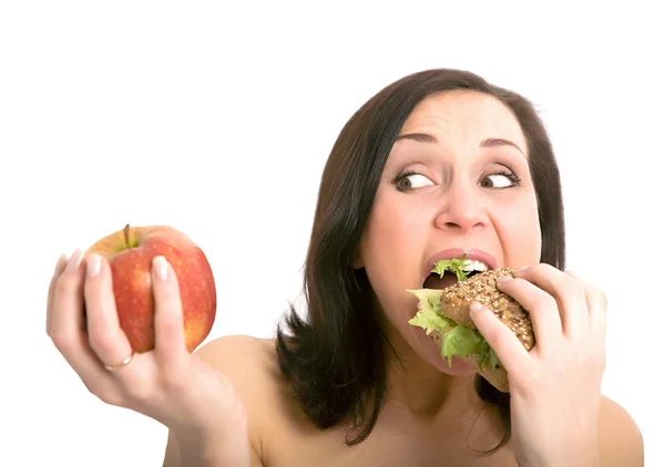 Vrouw hamburger eten Rechtenvrije Stockafbeeldingen