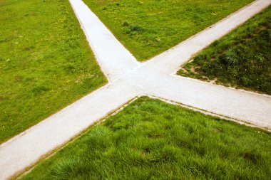 Crossroad in the country and green grass clipart