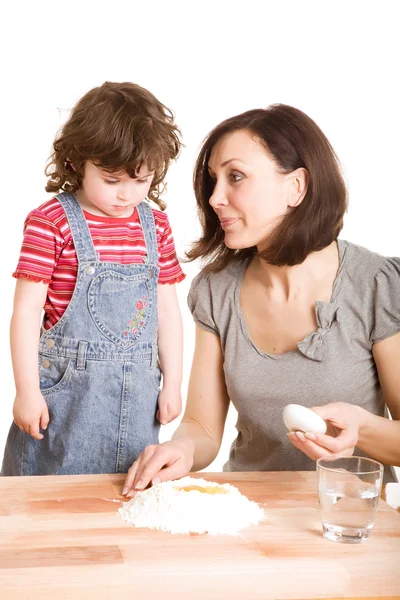 Mother and daughter making a dough — Stock Photo, Image