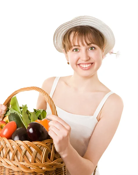 Girl holding a basket of fresh vegetables. — Stock Photo, Image