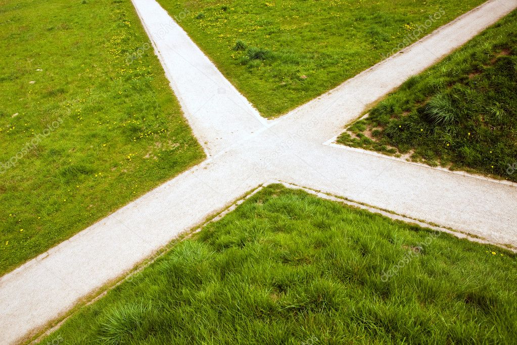 Crossroad in the country and green grass