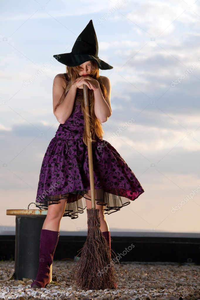 Pretty witch with hat and broom
