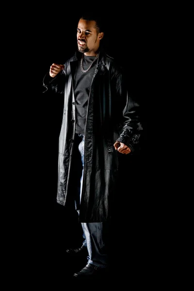Portret van cool latino man op zwart — Stockfoto