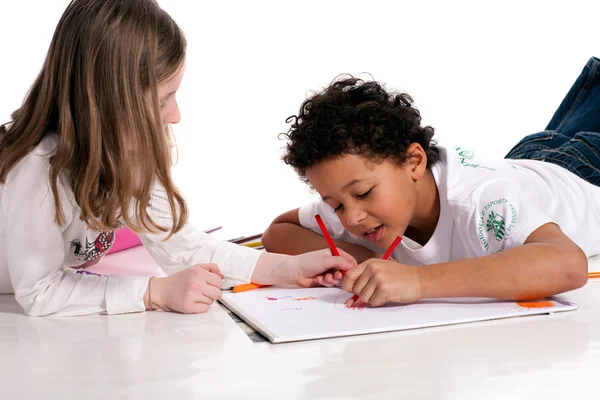 Interracial children drawing together — Stock Photo, Image