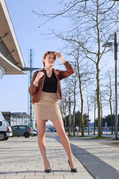 stock image Woman stands on street in town