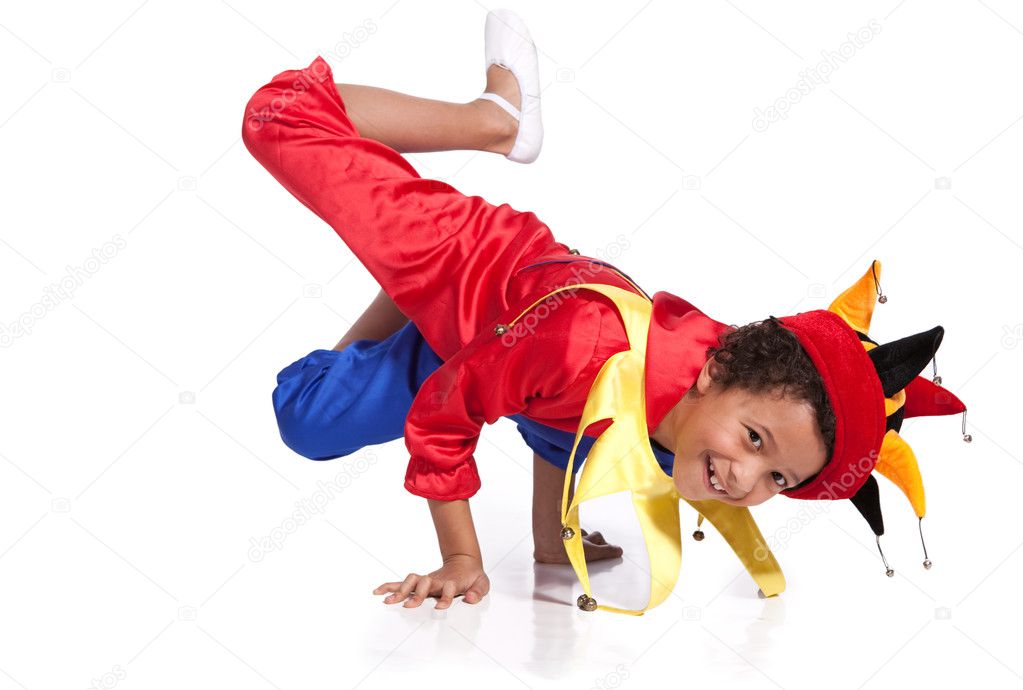 Breakdancing boy dressed in clown costume