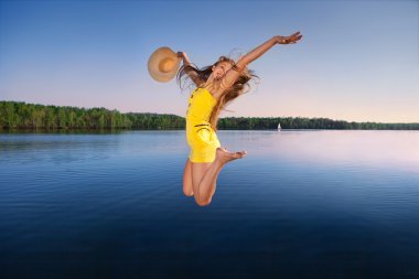 Young woman on the sky and water background clipart